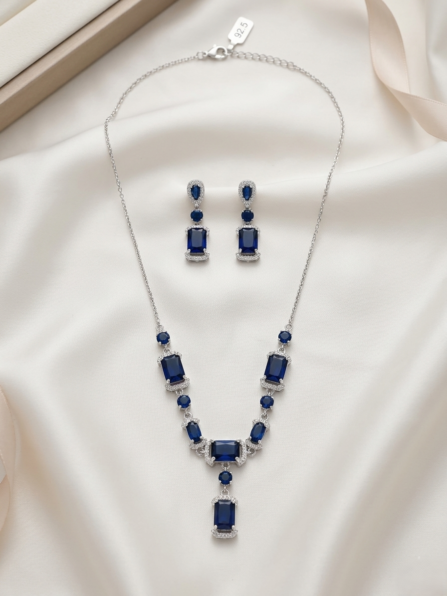 92.5 Sterling Silver Necklace earring set with cut blue stones